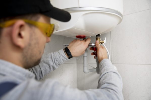 worker-repairing-water-heater-3